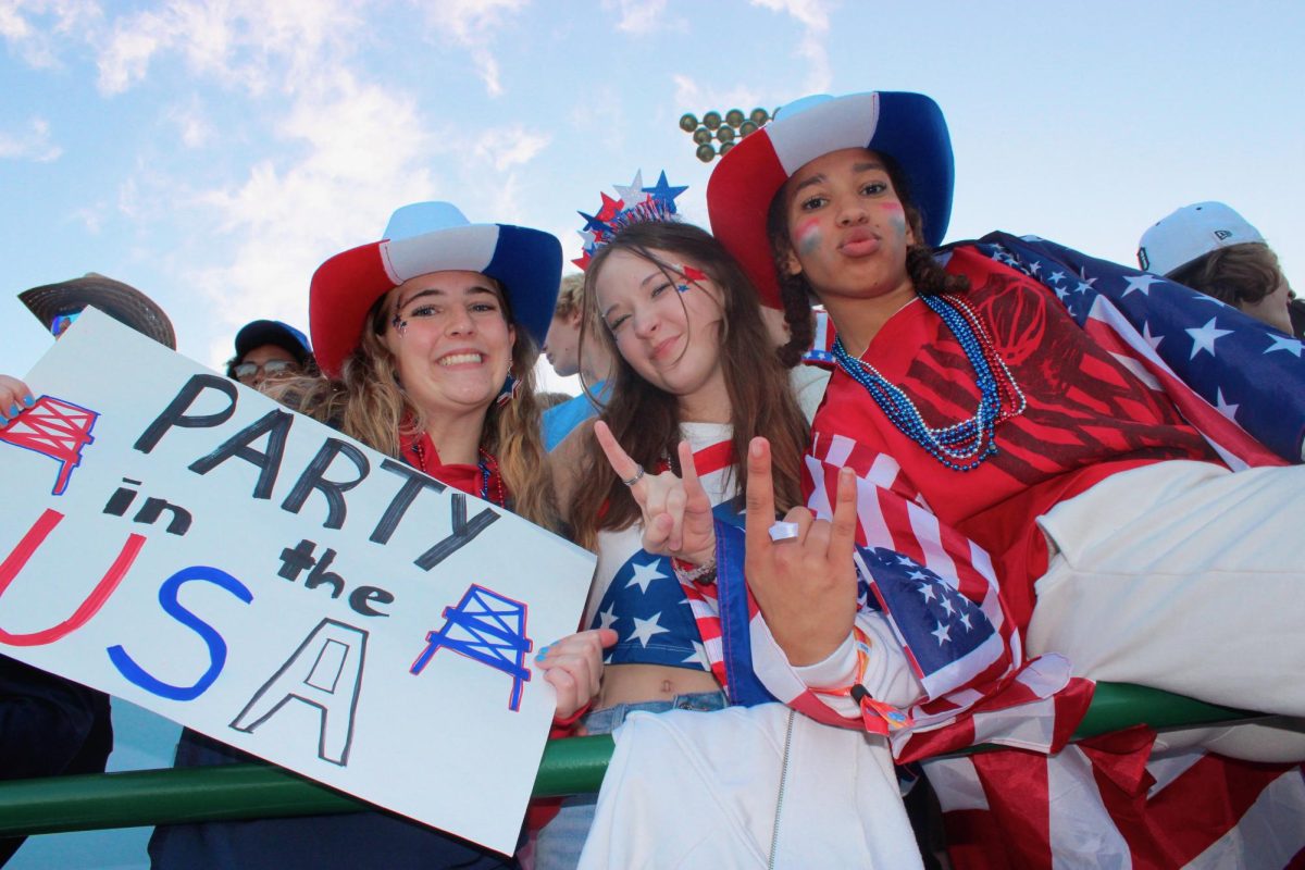 Its a party in the USA with Seniors Izzy Goodrich, Lilly Sponseller, and Abiona Bailey in the crowd