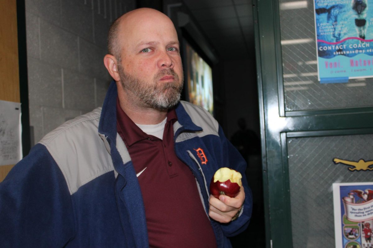 Mr. Beckman eats an apple