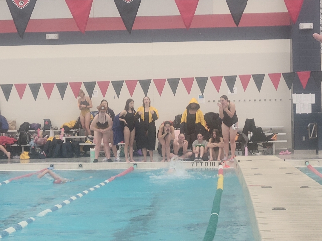 MPHS swimmers cheering for their teammate during the 400 freestyle relay.