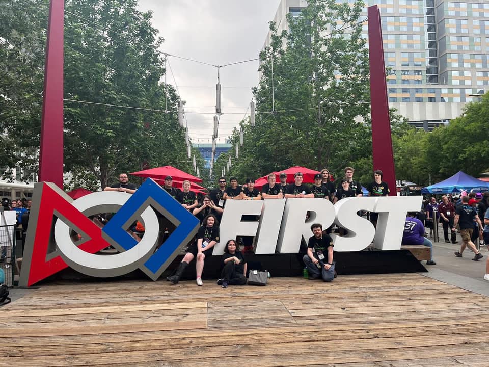 Team photo in front of the FIRST sign in Houston Texas!