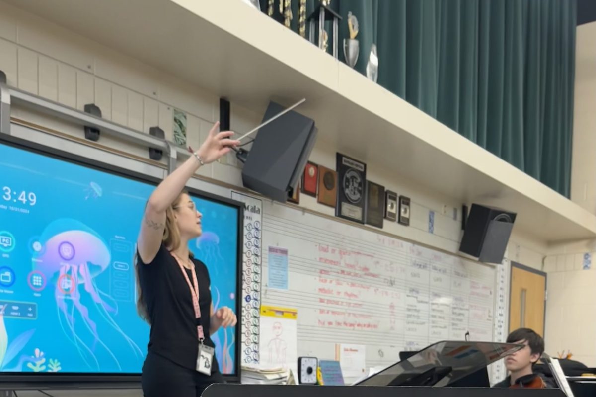 Ms. Cline conducting during class