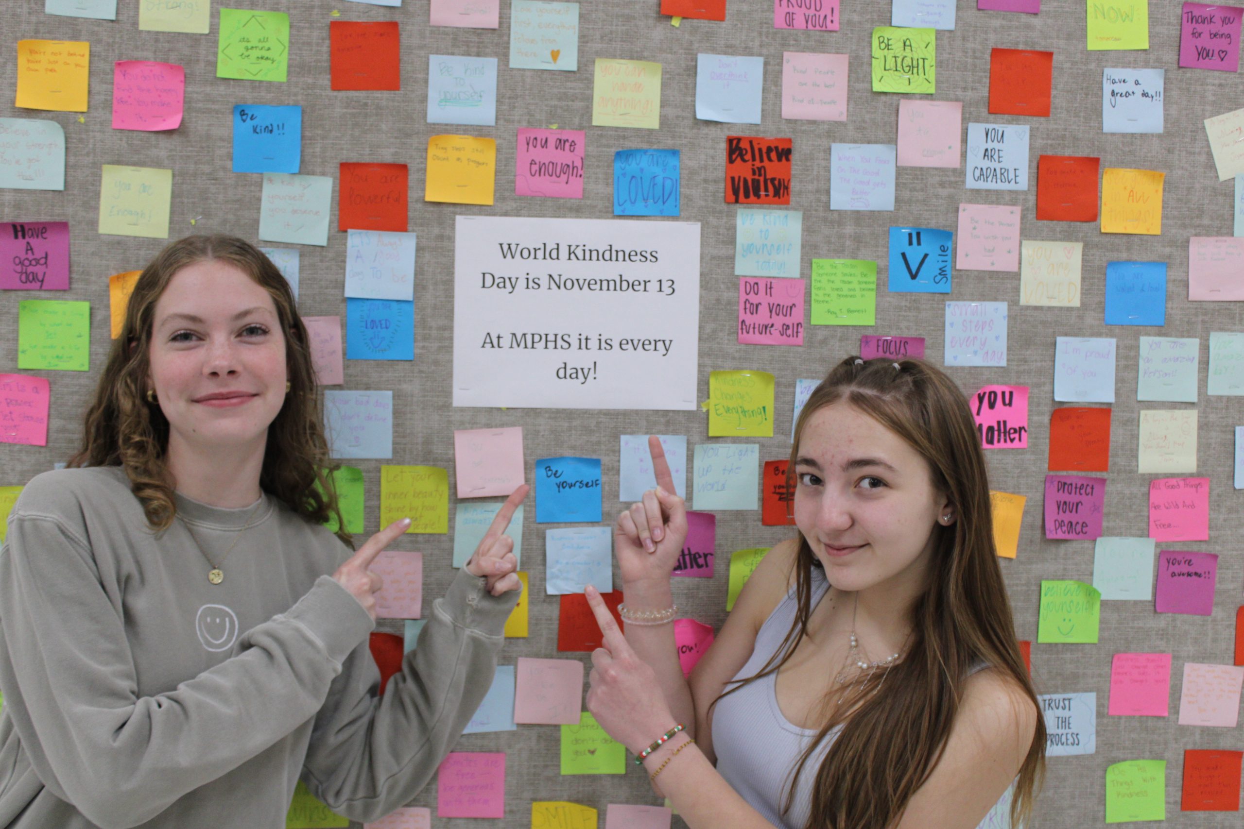 Amelia Russell and Alyssa White Show off our MPHS World Kindness Day Board 