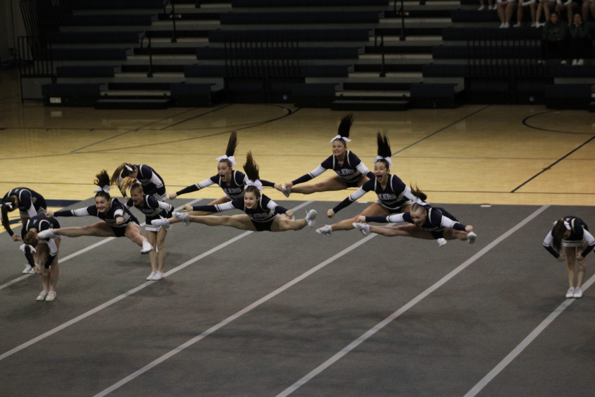 The Oiler's Talented Competitive Cheerleaders Performing A Toe Touch!