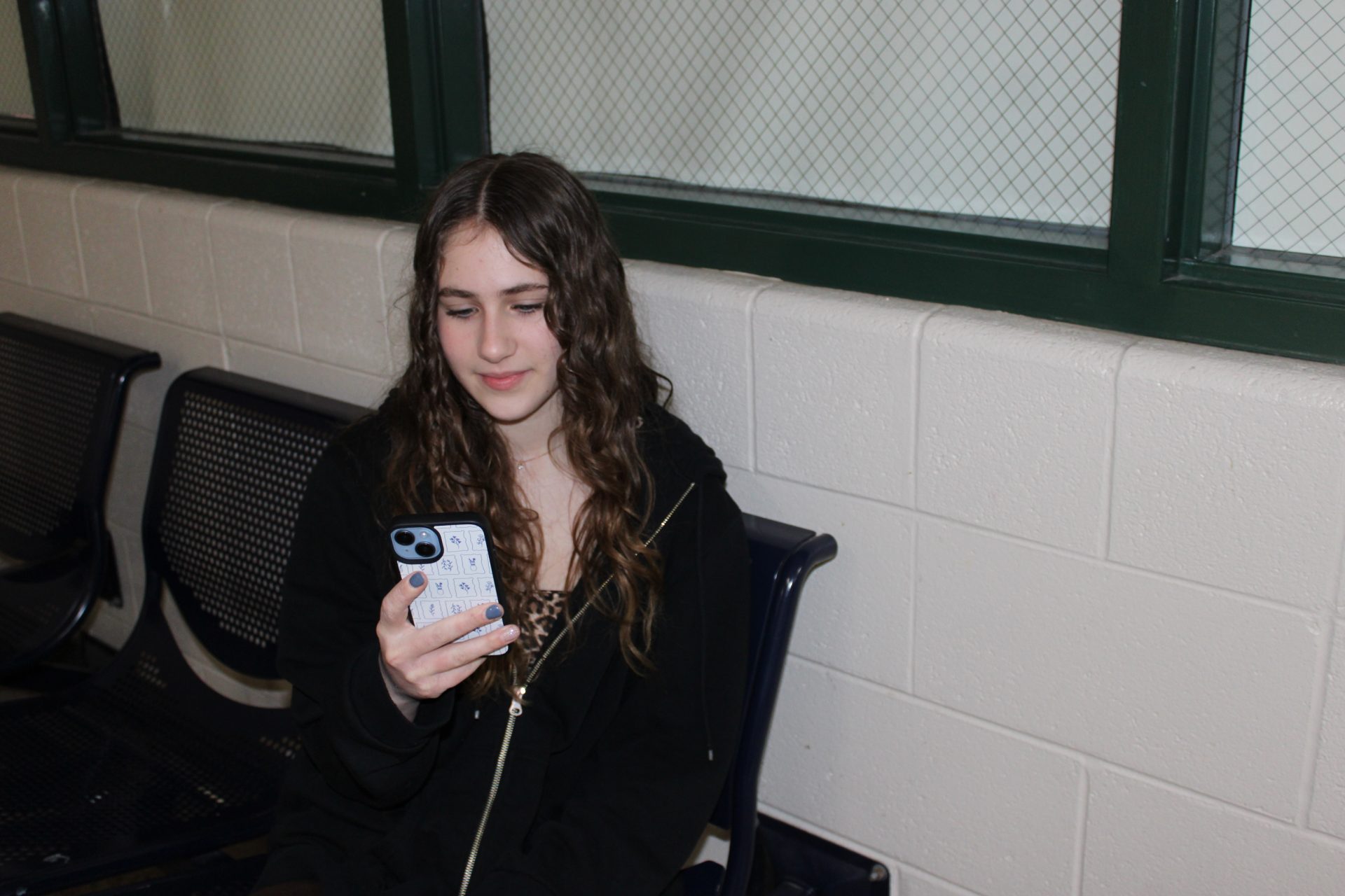 Skyler Malinowski using her phone
